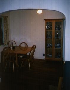 Wide shot of the drop leaf table I built of solid red oak and the china cabinet I built. 
