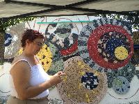 Julie hard at work setting tile 
