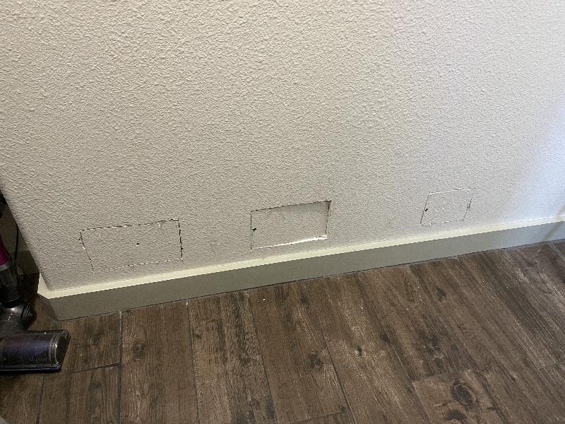 Drywall patches where outlets were added to other side 
