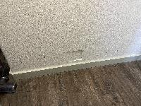 Drywall patches where outlets were added to other side 
